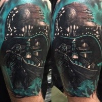 Cool illustrative style colored shoulder tattoo of Darth Vaders mask and Death Star