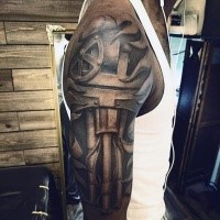 Cool looking black ink biomechanical style shoulder tattoo