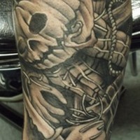 Cool looking colored forearm tattoo of cartoon like pumpkin monster with knife