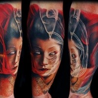 Cool looking colored forearm tattoo of very detailed monster geisha