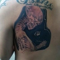 Cool looking X-Ray like human skeleton tattoo on back with small flower