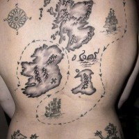 Cool nautical themed black ink massive treasure map tattoo on whole back with lettering
