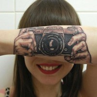 Cool old school colored camera tattoo on arm