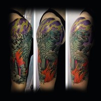 Cool painted multicolored Godzilla crushing the city half sleeve tattoo
