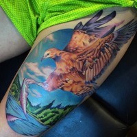 Cool painted realistic looking and colored fishing eagle tattoo on thigh