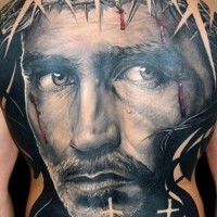 Cool portrait of jesus in a crown of thorns tattoo on whole back