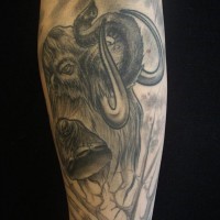 Cool realistic gray-ink mammoth tattoo on arm