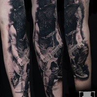 Cool realistic looking forearm tattoo of Slash guitarist