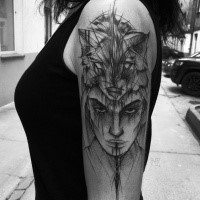 Cool sketch style black ink upper arm tattoo of mysterious woman with animal skin helmet