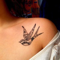 Cool small bird tattoo on collarbone