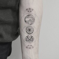 Creative black ink forearm tattoo of various small pictures