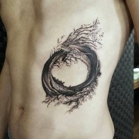 Creative looking black ink side tattoo of circle shaped wave