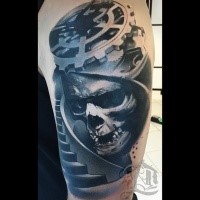 Creepy biomechanical style shoulder tattoo of human skull with big stairs