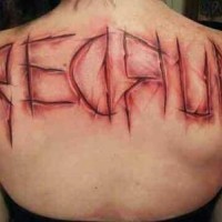 Creepy colored scars like bloody lettering tattoo on upper back