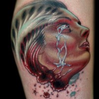 Creepy colored severed woman`s head bloody tattoo