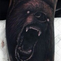 Creepy demonic like colored roaring bear tattoo on leg