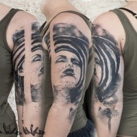 Creepy looking black ink shoulder tattoo corrupted woman face