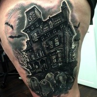 Creepy looking black ink thigh tattoo of dark house and cemetery