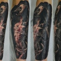 Creepy looking colored arm tattoo of monster woman with gas mask