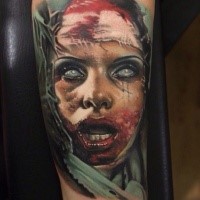 Creepy looking colored forearm tattoo of bloody monster woman