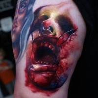 Creepy looking colored horror style tattoo of monster face