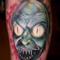 Creepy looking colored leg tattoo of creepy monster face