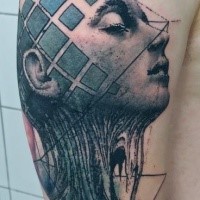 Creepy looking colored shoulder tattoo of mystic woman face with ornaments