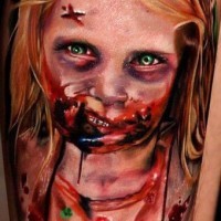 Creepy painted horrifying bloody monster girl tattoo on leg
