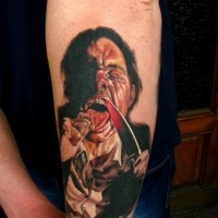 Creepy very realistic looking colored man with knife tattoo on forearm