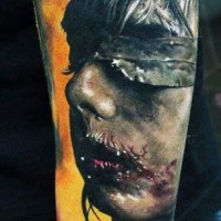 Creepy zombie like bloody female monster tattoo on arm