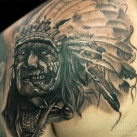 Creepy zombie like Indian chief tattoo on shoulder