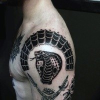 Crossed pirate daggers, cobra's head and spiderweb fragment tattoo on shoulder in old school style