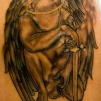 Crying angel with a sword tattoo