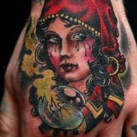 Crying young pretty Gypsy and broken magic ball traditional colored hand tattoo