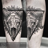 Cult style black ink forearm tattoo of animal skull with black triangle