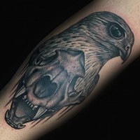 Cult style black ink leg tattoo of eagle head and animal skull