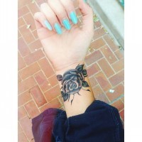 Cute black and gray rose wrist tattoo