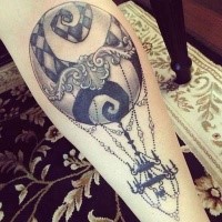 Cute black and white forearm tattoo of flying balloon with chandelier