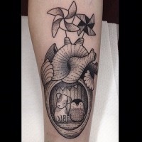 Cute cartoon like black and white heart shaped home with animals tattoo on arm