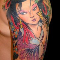 Cute cartoon like colored shoulder tattoo of Asian geisha portrait and flowers