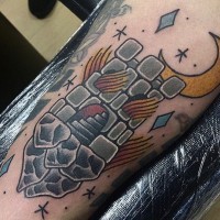 Cute cartoon like little tower with moon tattoo on arm