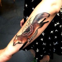 Cute colorful fox forearm tattoo