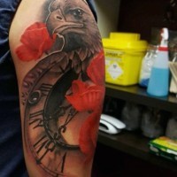 Cute combined nice colored eagle shoulder tattoo with old clock and red poppy