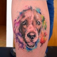 Cute dog's portrait calf tattoo by Javi Wolf with colored watercolor details