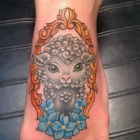 Cute gray sheep in mirror frame with flowers tattoo on foot