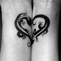 Cute heart shaped dark black ink curled lizards couple tattoo on both wrists