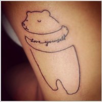 Cute hugging bear tattoo