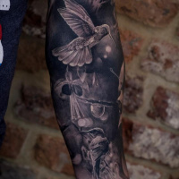Cute hummingbirds tattoo on forearm