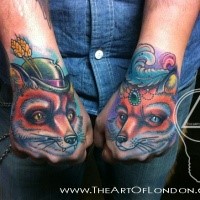 Cute illustrative style colored arms tattoo of foxes couple