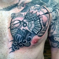 Cute little cartoon like skull shaped Poseidon tattoo on chest